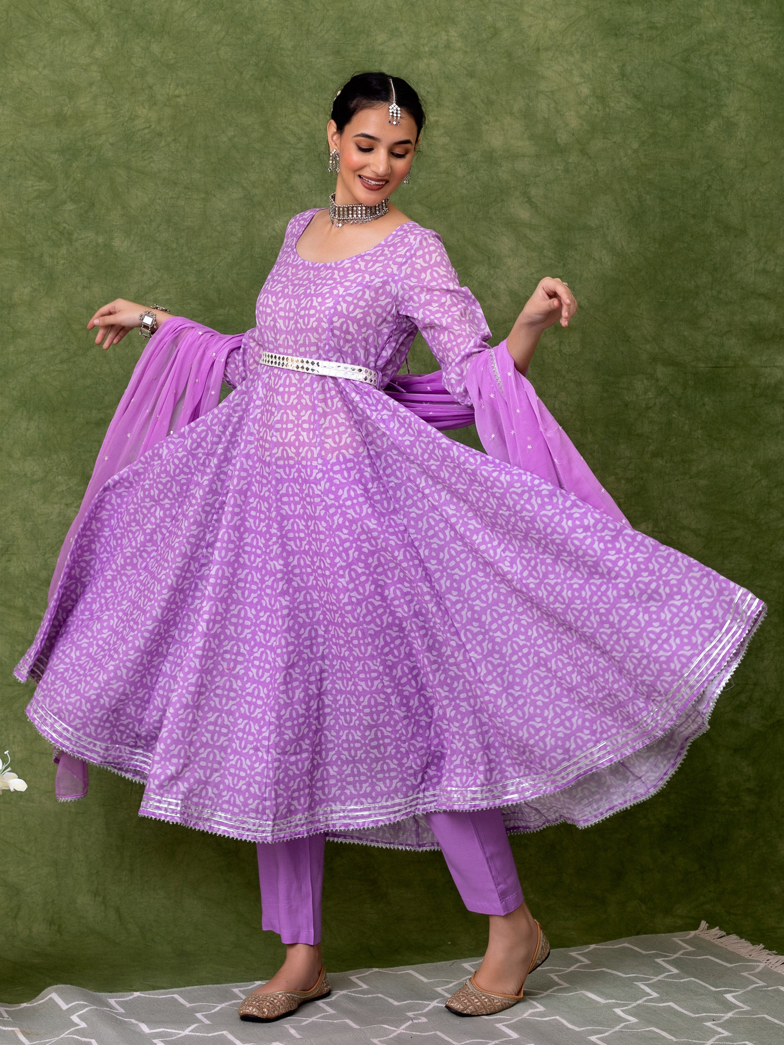 this-printed-lavender-anarkali-kurta-is-perfect-for-special-occasions-crafted-from-cotton-the-kurta-features-a-beautiful-print-a-mirror-work-belt-and-an-embroidered-dupatta