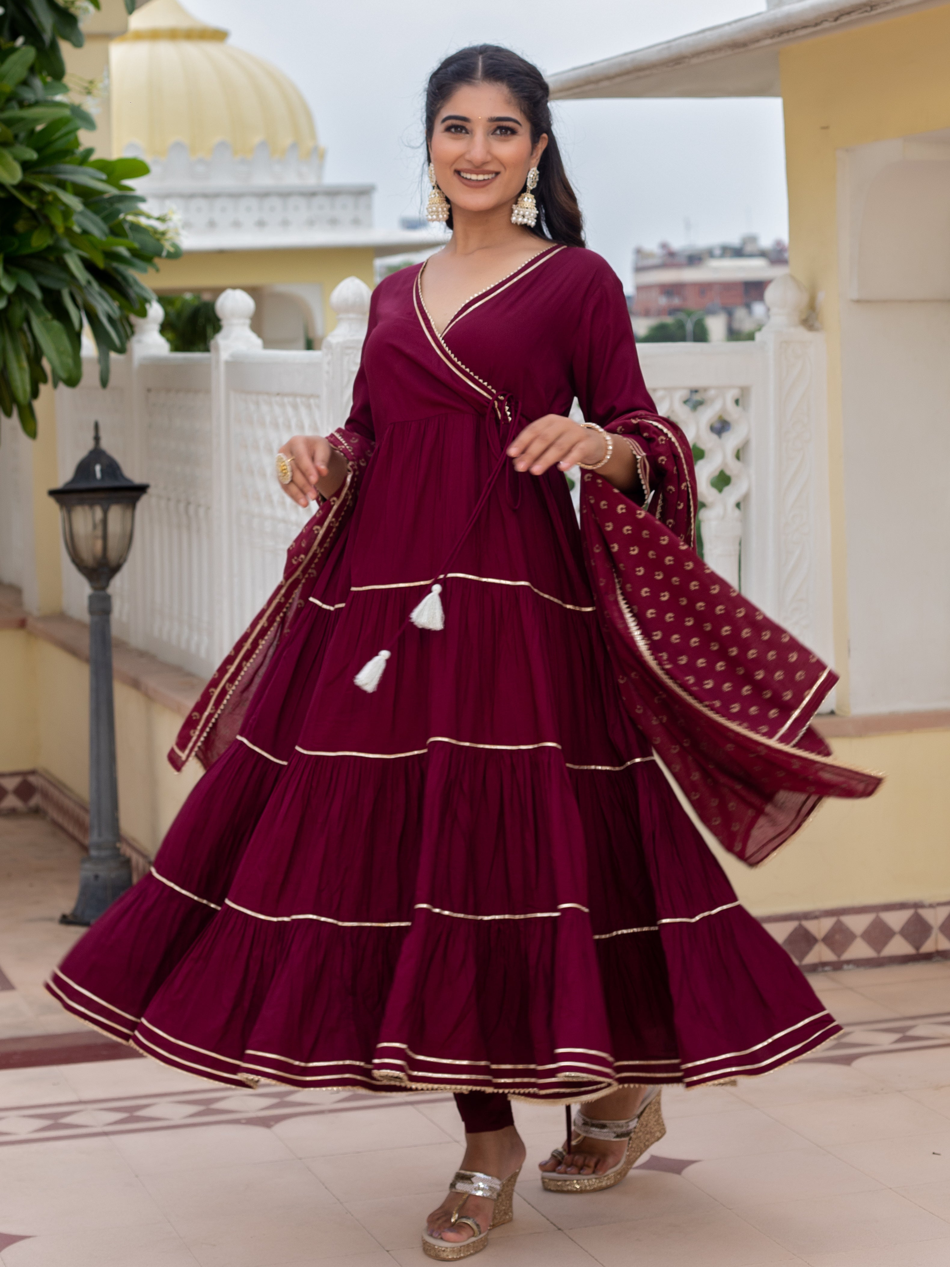 this-burgundy-tiered-kurta-has-been-expertly-crafted-with-a-stylish-tiered-design-featuring-a-kurta-pants-and-a-dupatta-this-three-piece-outfit-will-add-a-touch-of-elegance-to-any-wardrobe