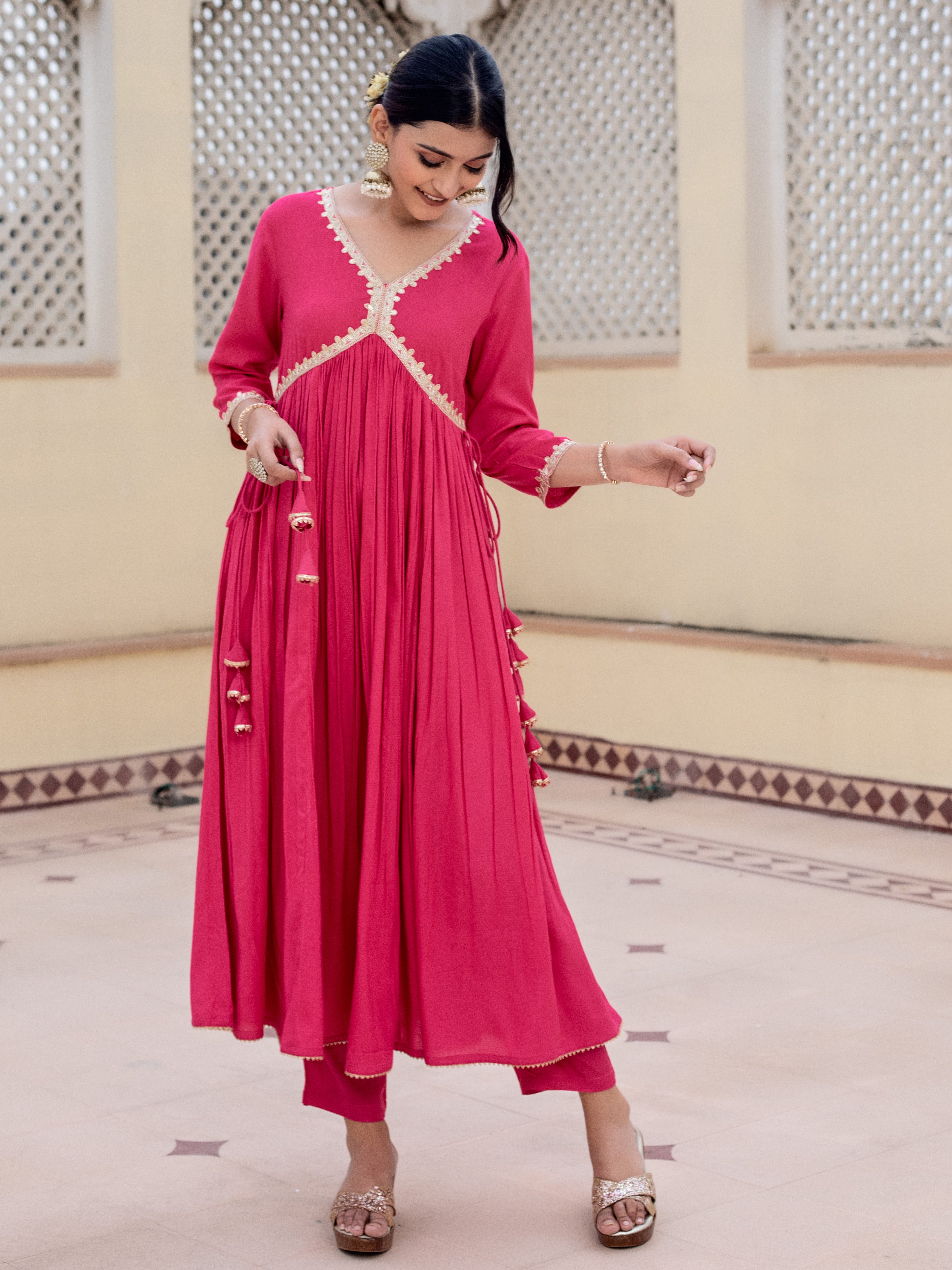 look-effortlessly-stylish-with-this-beautiful-v-neck-pink-a-line-kurta-with-pant-featuring-intricate-lace-detailing-and-side-tassels-this-kurta-is-sure-to-make-a-statement-and-is-perfect-for-a-variety-of-occasions