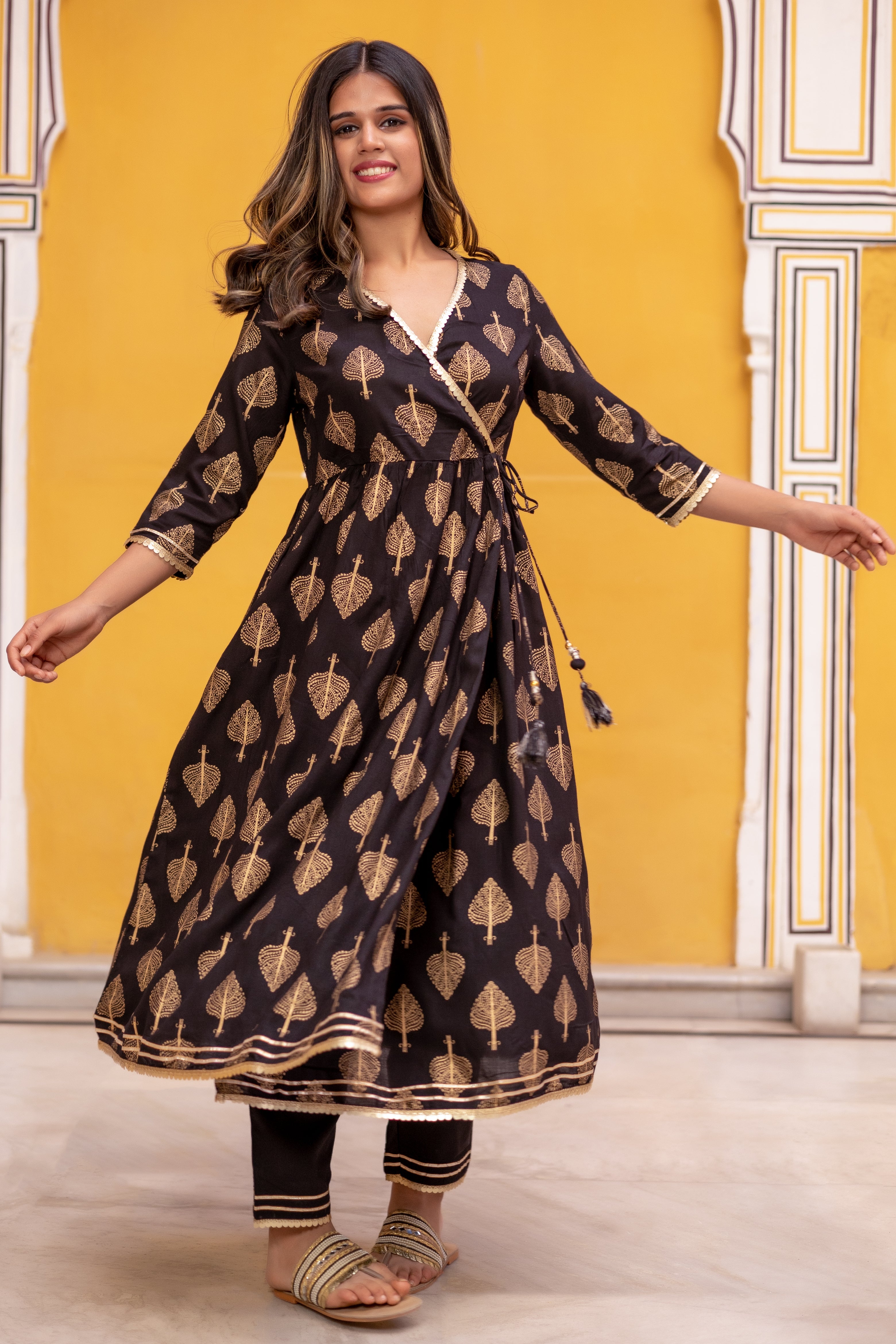 Black Gold Printed Angarkha Style Flared Kurti with Gathers and Narrow Pant.
