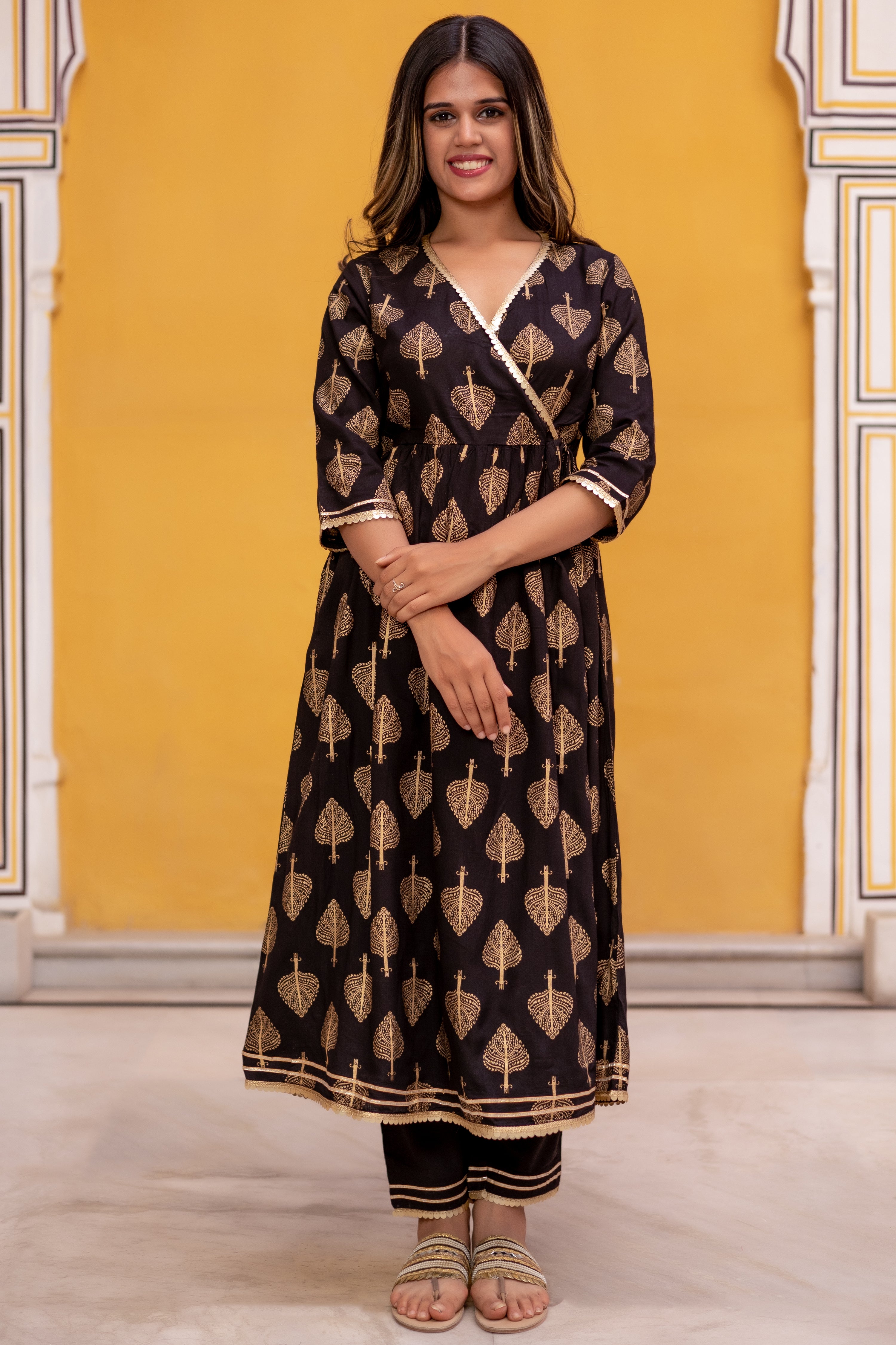 Black Gold Printed Angarkha Style Flared Kurti with Gathers and Narrow Pant.
