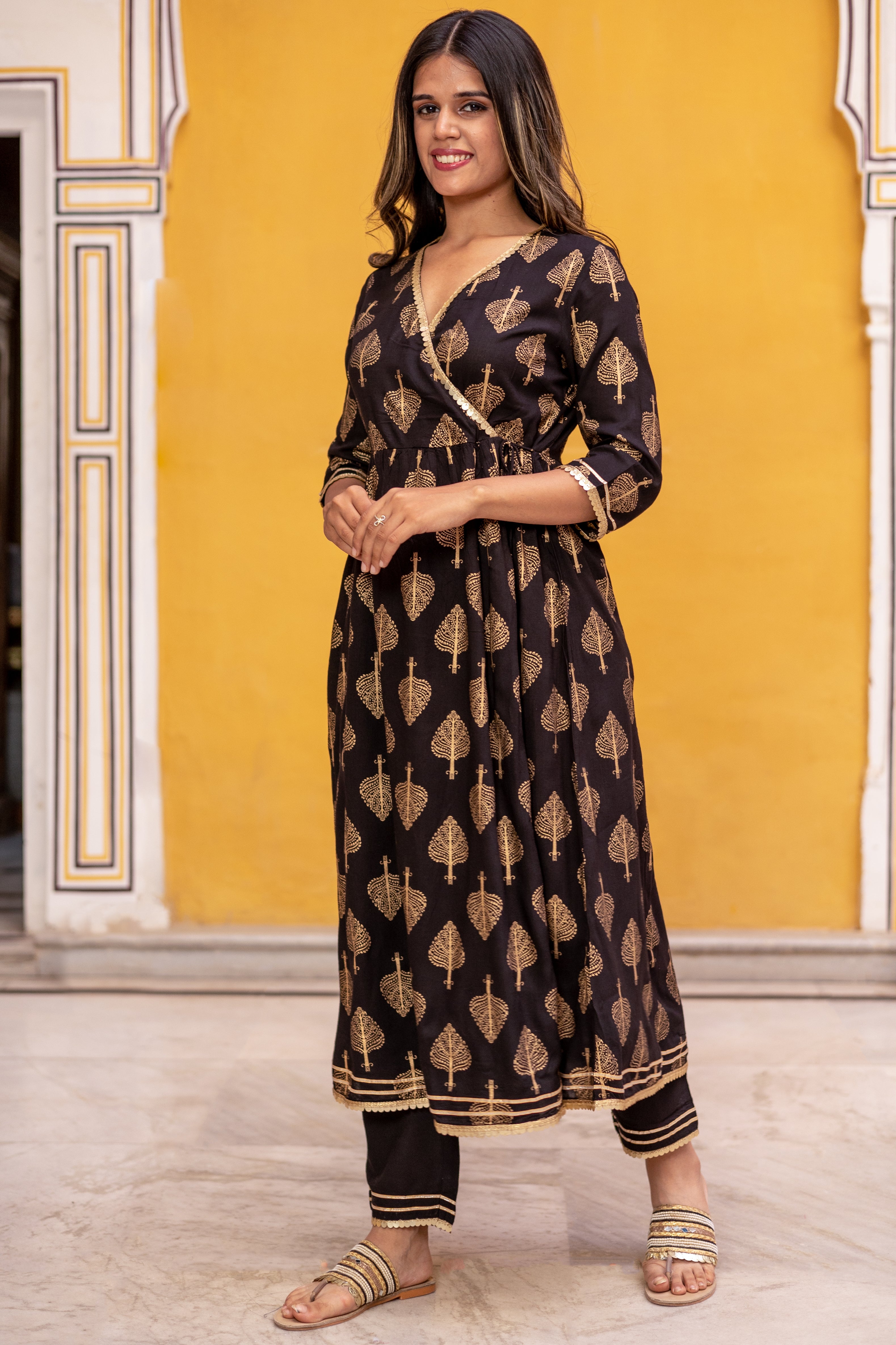 Black Gold Printed Angarkha Style Flared Kurti with Gathers and Narrow Pant.