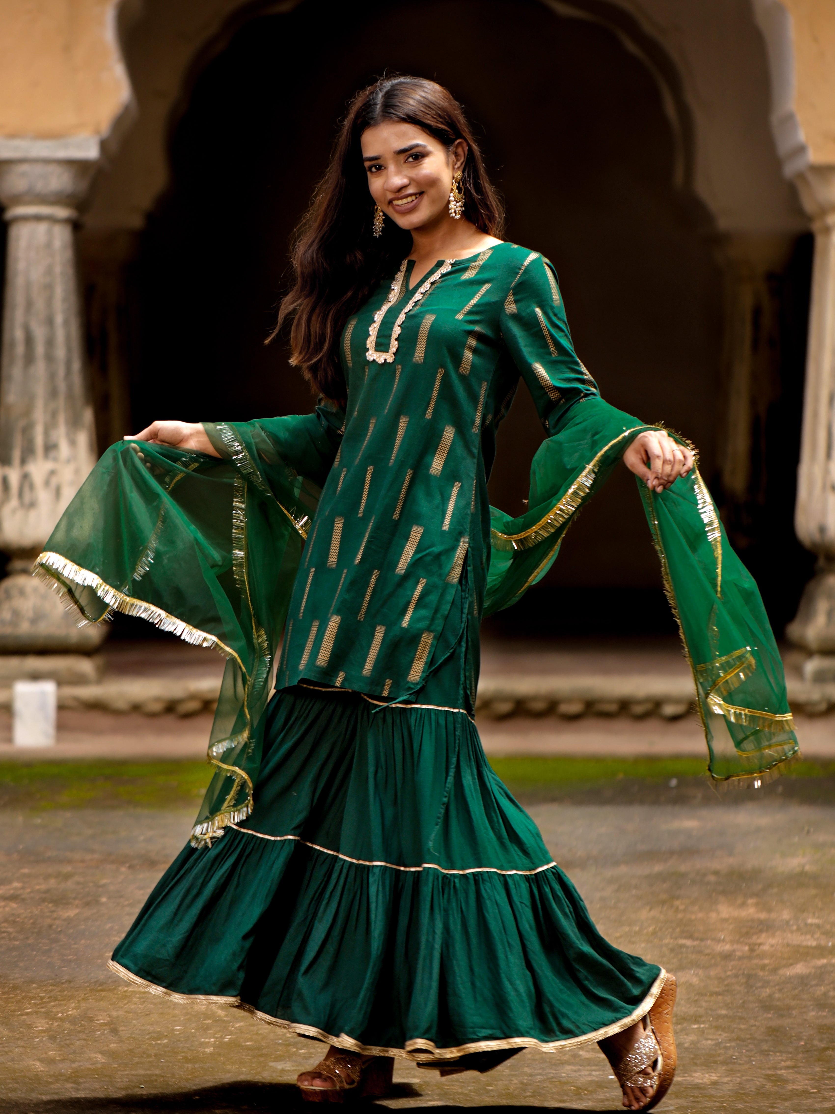green-gold-printed-straight-kurti-set-with-round-neck-and-quarter-sleeves-in-rayon-slub-paired-with-tiered-sharara-and-dupatta
